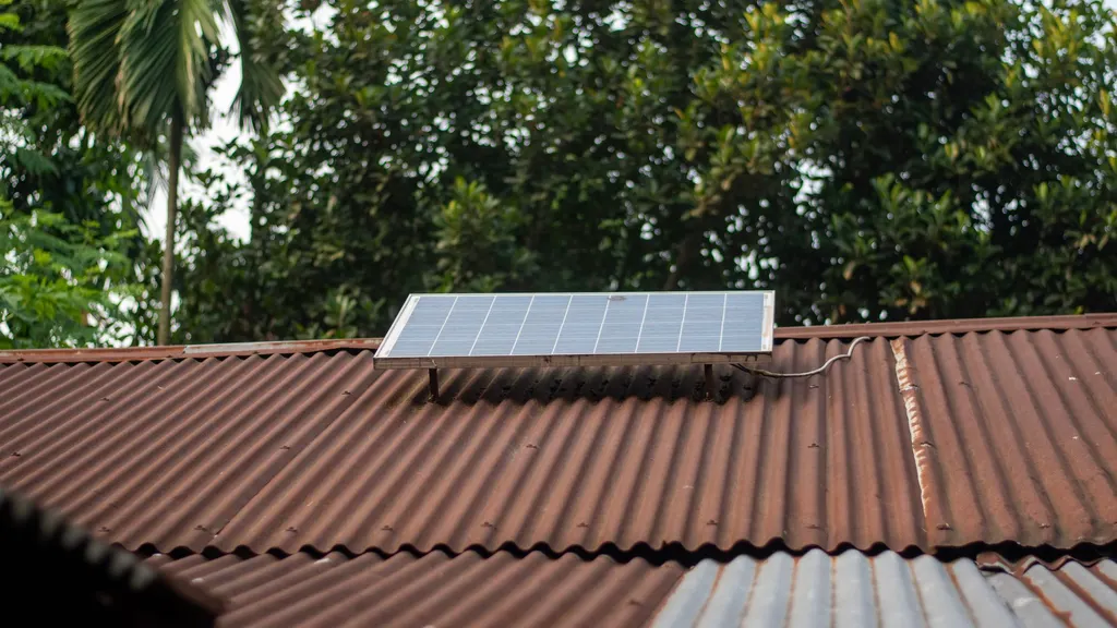 Solar carport canopy at a commercial parking lot financed through C-PACE solar financing with integrated battery storage units below